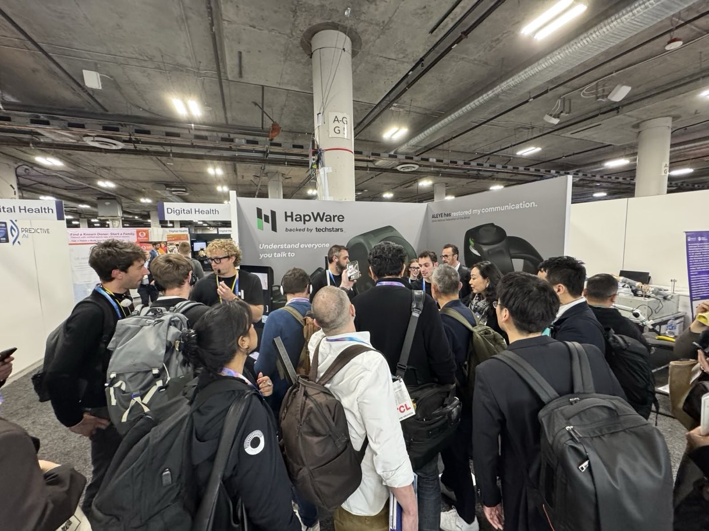 A crowd gathered around the HapWare booth at CES 2026